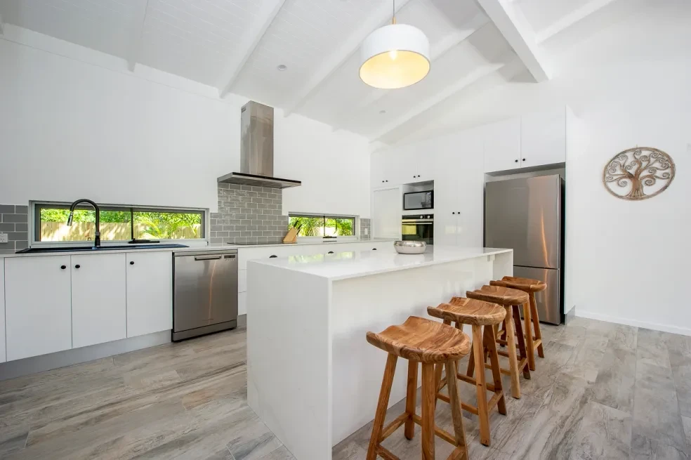 42 HL — white kitchen with island, timber stools and raked ceiling
