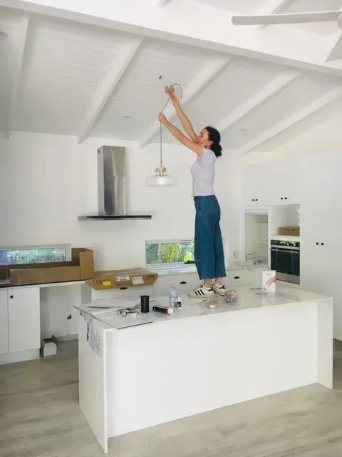 42 HL — kitchen under construction with pendant light installation