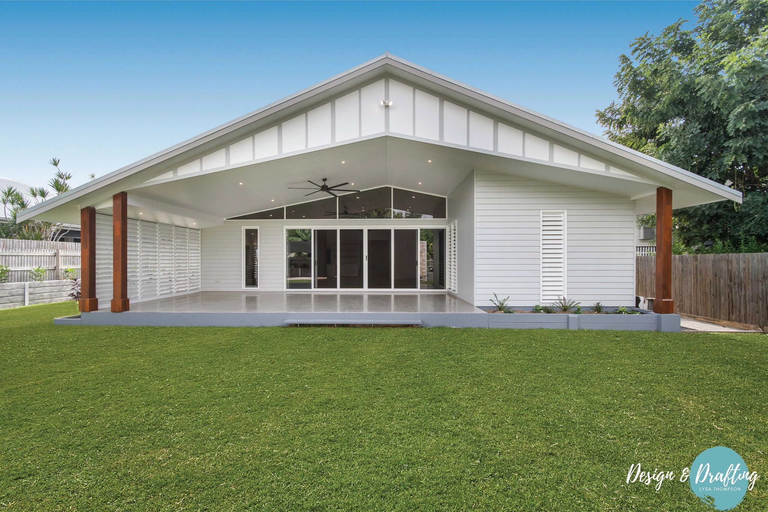 Modern residential home with white siding and pitched roof patio