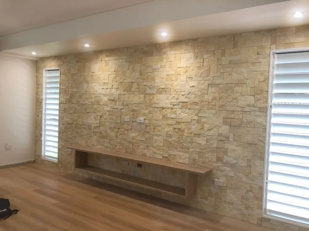 Myserton — stone feature wall with floating shelf and plantation shutters