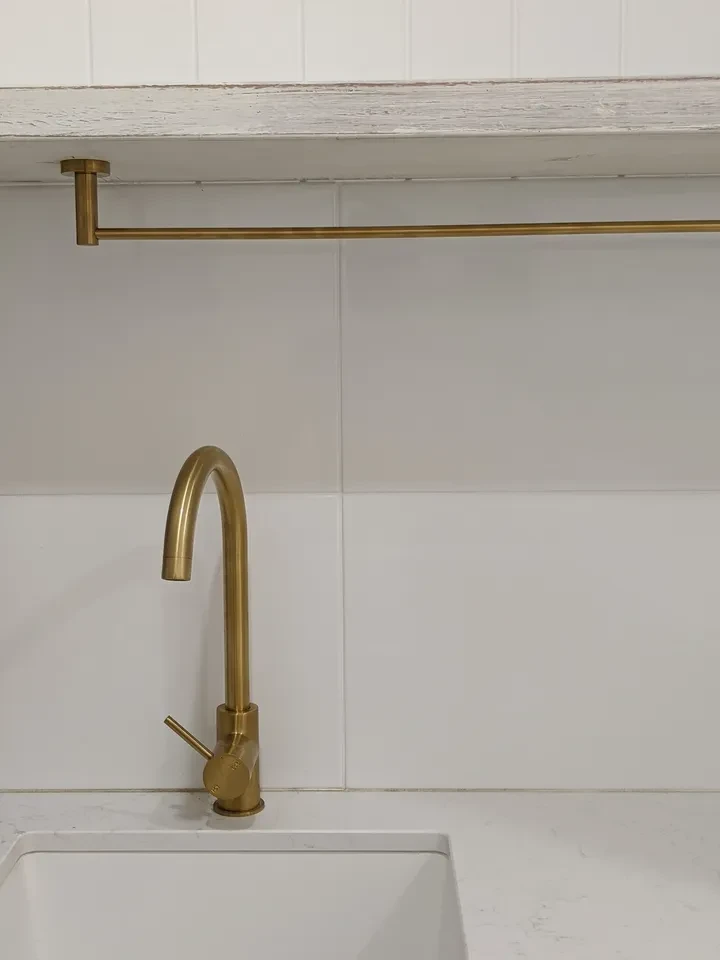 reef shack — brass kitchen tap and towel rail detail