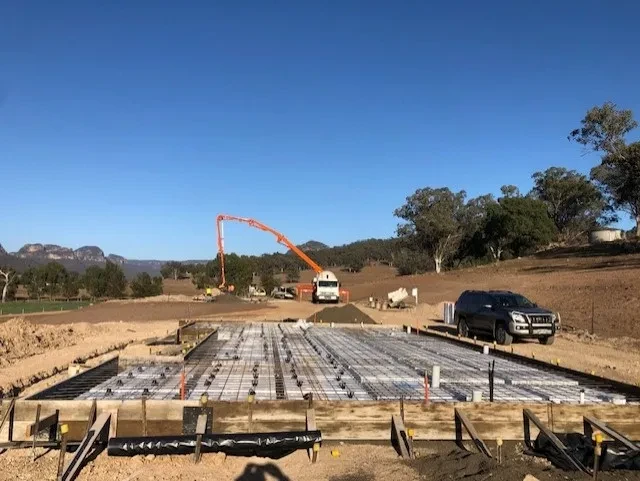 WIDDEN — reinforced slab formwork with concrete pump and ute on site